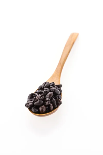 Coffee beans on spoon — Stock Photo, Image