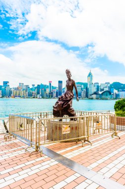 Statue and skyline in Avenue of Stars in Hong Kong, China clipart