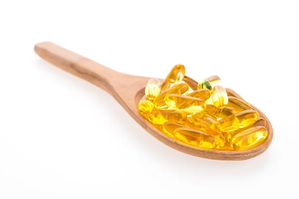 Fish oil in wooden spoon — Stock Photo, Image