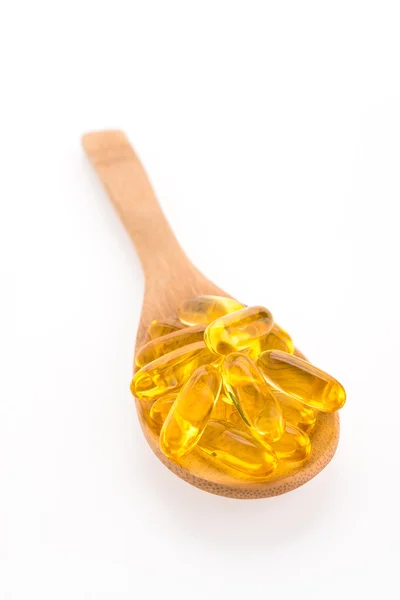 Fish oil in wooden spoon — Stock Photo, Image