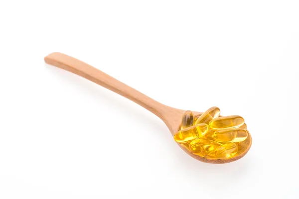 Fish oil in wooden spoon — Stock Photo, Image