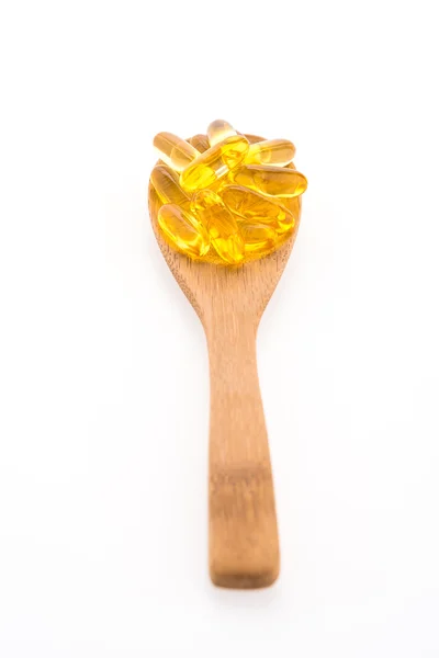 Fish oil in wooden spoon — Stock Photo, Image