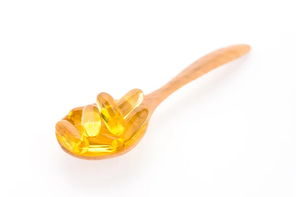 Fish oil in wooden spoon — Stock Photo, Image