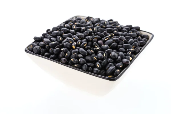 Černé fazole izolované na bílém pozadí — Stock fotografie