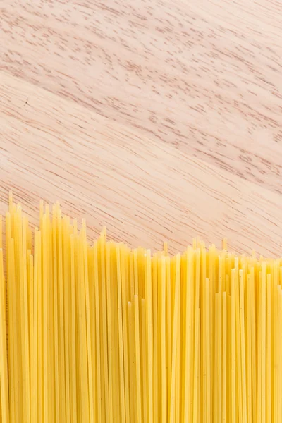 Pasta on wooden background — Stock Photo, Image