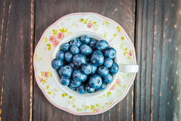 Blueberry cup on wooden — Stock Photo, Image