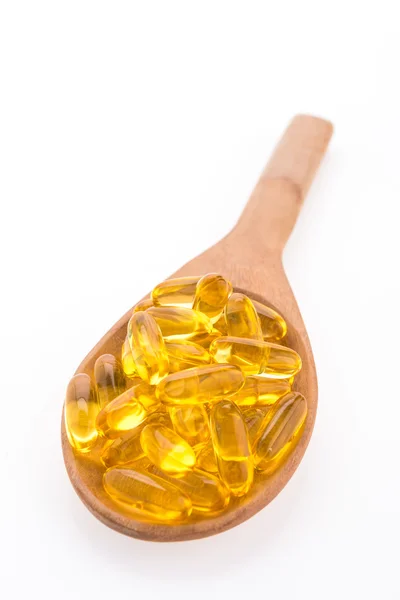 Fish oil in wooden spoon — Stock Photo, Image