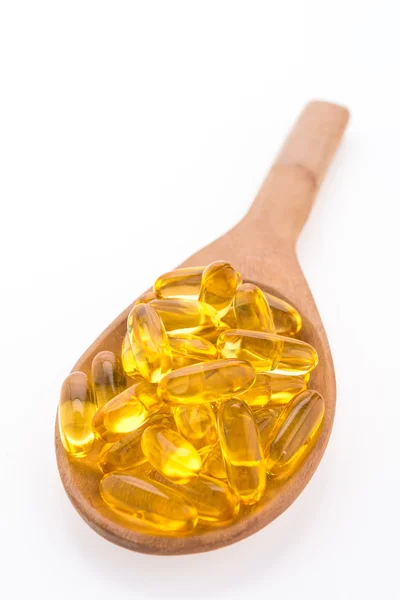 Fish oil in wooden spoon — Stock Photo, Image