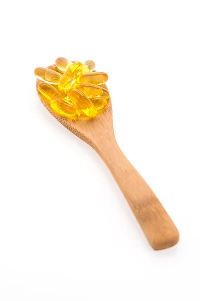 Fish oil in wooden spoon — Stock Photo, Image
