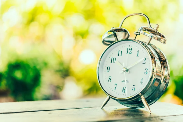 Alarm clock on table — Stock Photo, Image