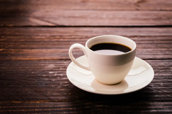 Coffee cup on wooden table — Stock Photo, Image