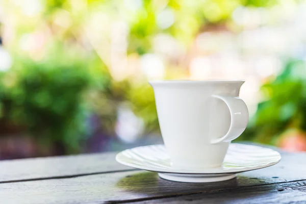 Coffee cup on wooden table — Stock Photo, Image