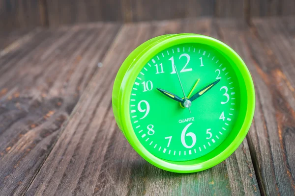 Clock on wood background