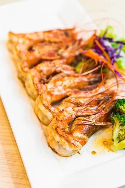 Steak shrimps in white plate — Stock Photo, Image