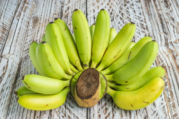 Bananas on wooden background — Stock Photo, Image