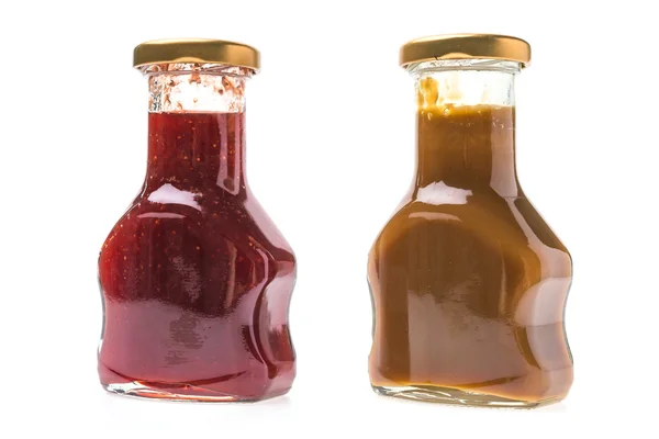 Caramel sauce and strawberry jam — Stock Photo, Image