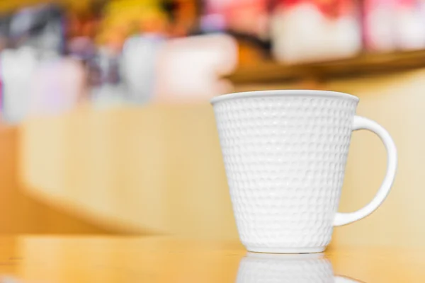 Coffee cup in coffee shop — Stock Photo, Image