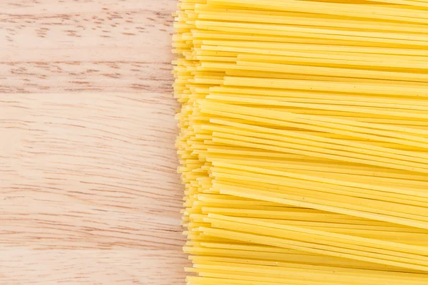 Pasta on wooden background — Stock Photo, Image