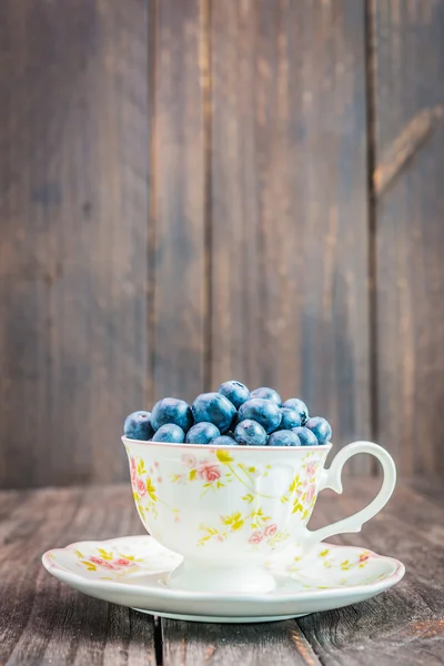 Blueberry cup on wooden background — Stock Photo, Image