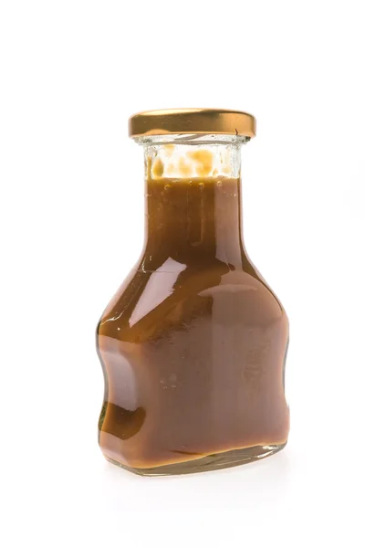 Caramel sauce bottle — Stock Photo, Image