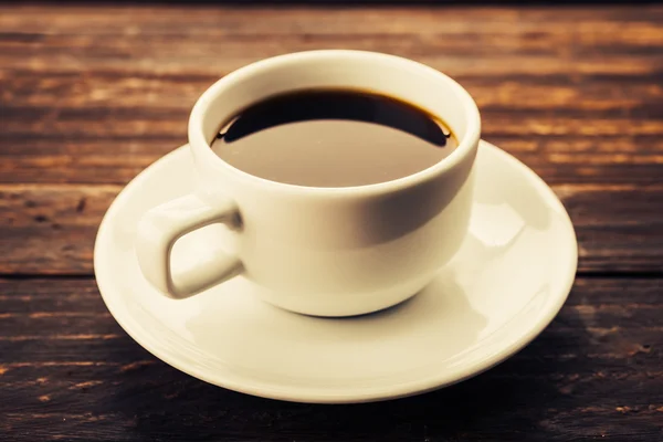 Tazza di caffè su sfondo di legno — Foto Stock