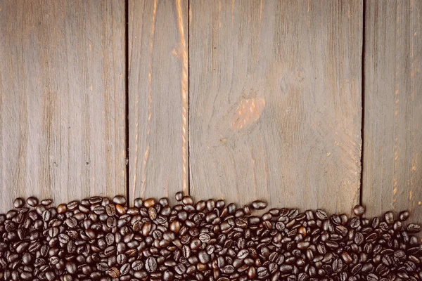 Coffee beans on wooden background — Stock Photo, Image