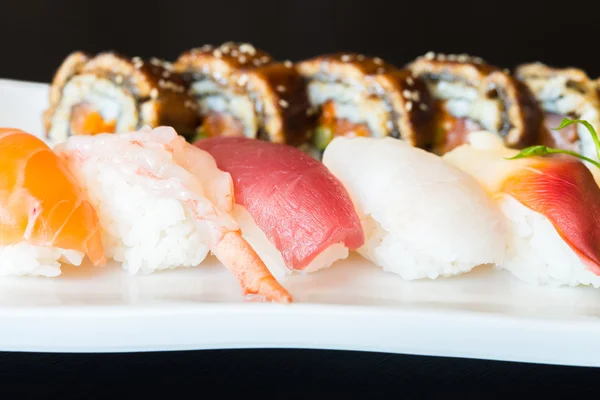 Sushi rolls on white dish — Stock Photo, Image