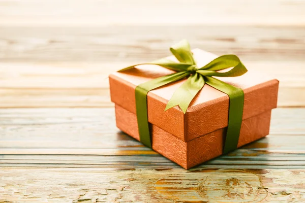 Gift box on wooden background — Stock Photo, Image