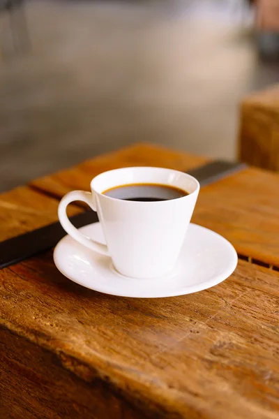 Coffee cup on wooden table Royalty Free Stock Images