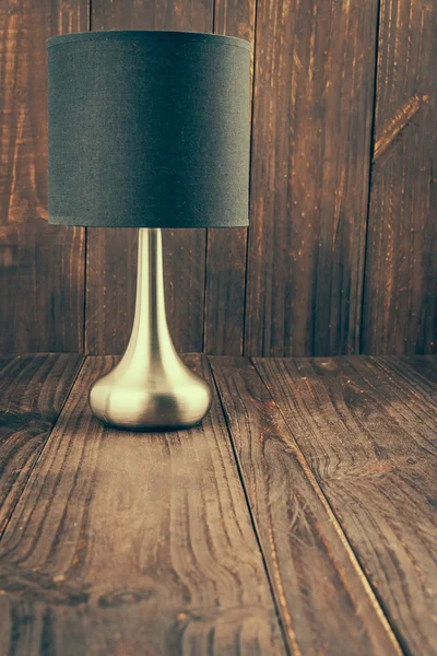 Lampada Lampada su fondo legno — Foto Stock