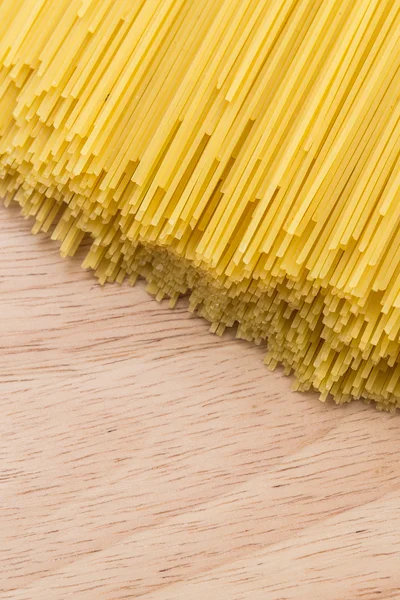 Pasta on wooden background — Stock Photo, Image