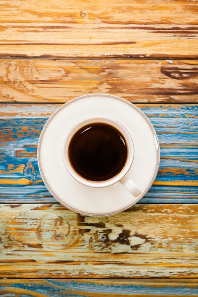 Coffee cup on wooden table — Stock Photo, Image