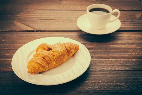 Croissant a káva — Stock fotografie