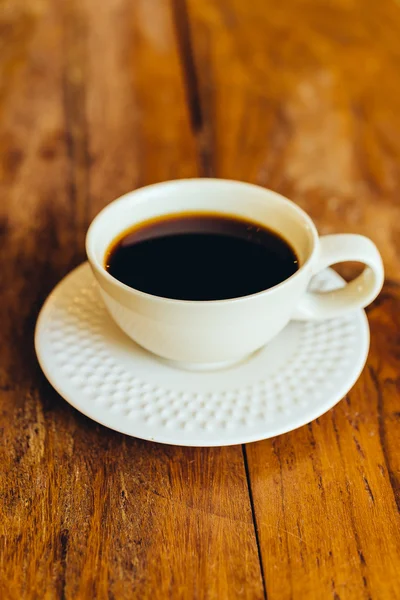 Coffee cup on wooden table — Stock Photo, Image