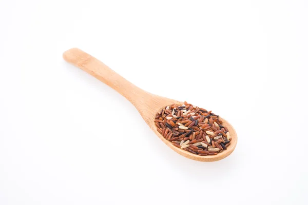 Rice brown on spoon — ストック写真
