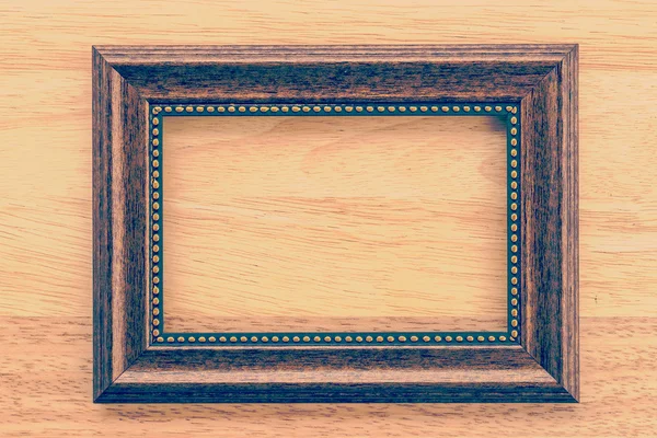 Vintage frame op houten achtergrond — Stockfoto