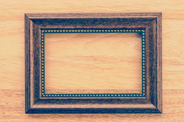 木制背景上的复古框架 — 图库照片