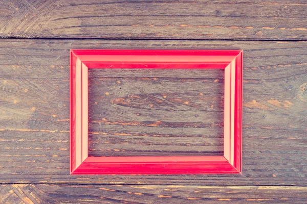 Photo frame on wooden background — Stock Photo, Image