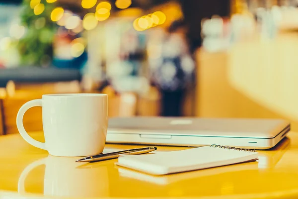 Office desk with coffee cup — Stock Photo, Image