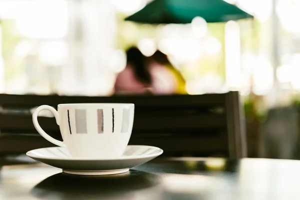 Coffee cup on wooden table — Stock Photo, Image