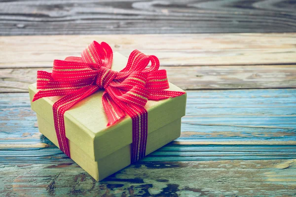 Gift box on wood background — Stock Photo, Image