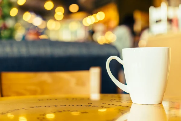 Coffee cup on wooden table — Stock Photo, Image