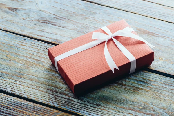 Gift box on wood background — Stock Photo, Image