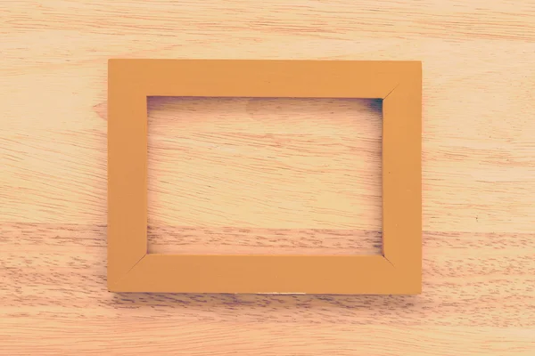 Vintage frame on wooden background — Stock Photo, Image