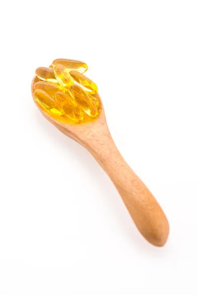 Fish oil in wooden spoon — Stock Photo, Image