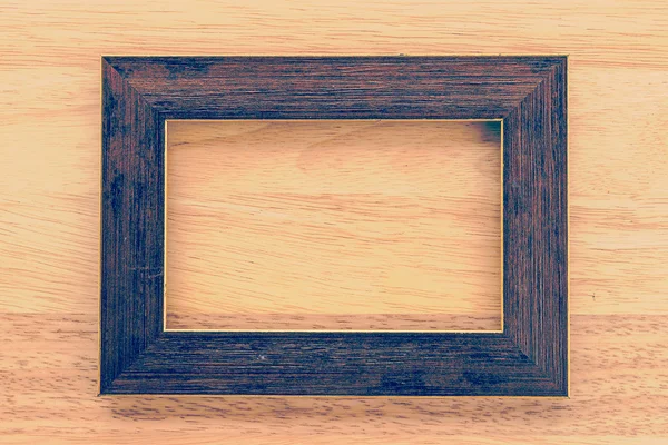 Cornice vintage su sfondo in legno — Foto Stock