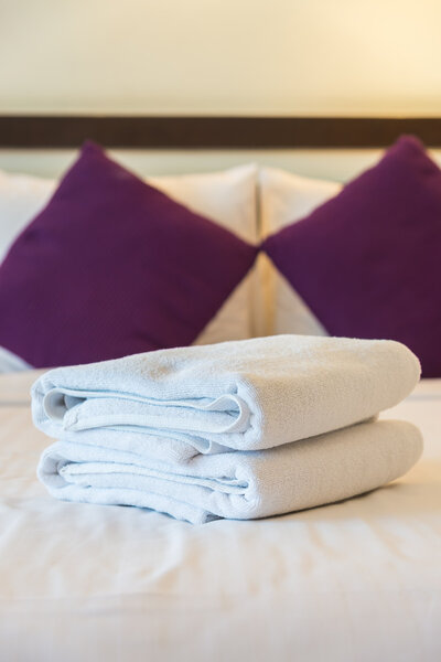 Towel on bed in bedroom