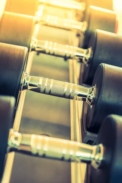 Dumbbells set in gym — Stock Photo, Image