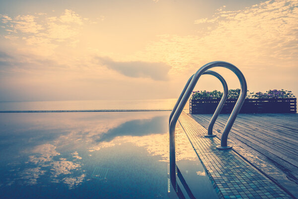 Staircase in pool in twilight times