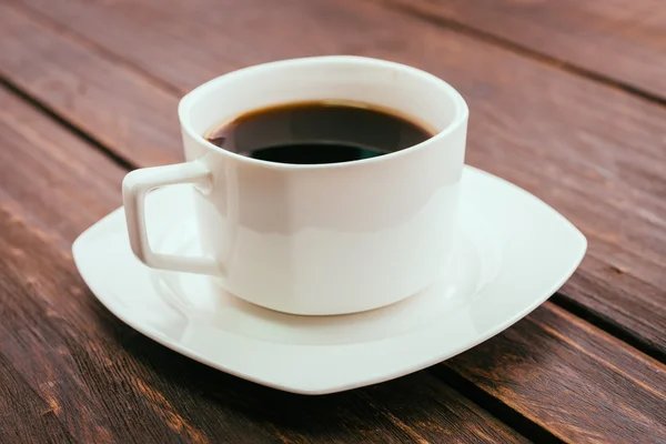 Kaffeetasse auf Holzgrund — Stockfoto